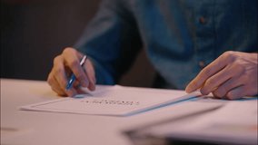 Arabian Indian man guy businessman writing notes on desk male business employer manager executive lawyer worker in late night office overtime work write papers sign contract documents bank insurance - Powered by Shutterstock - Get 15% off with code: PIKWIZARD15