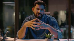 Indian man smiling positive guy male business coach businessman mentor influencer leader entrepreneur HR manager at dark night office talking to camera consultation motivation speech teaching consult - Powered by Shutterstock - Get 15% off with code: PIKWIZARD15