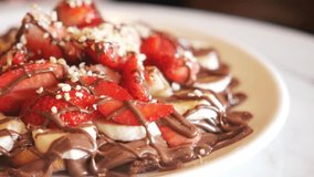Delicious dessert featuring fruits and chocolate drizzled on waffles - Powered by Shutterstock - Get 15% off with code: PIKWIZARD15