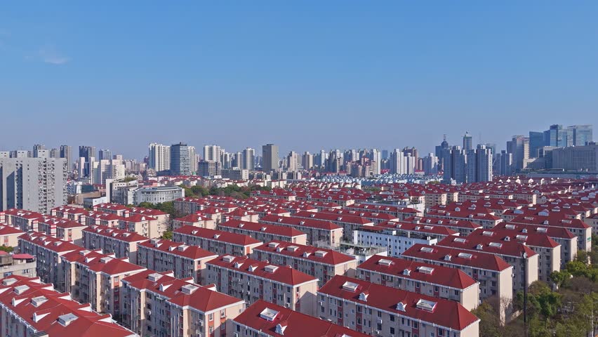 Shanghai, China - March 21st 2025: 4K real time Aerial view of Neatly planned residential district in downtown in sunny day.