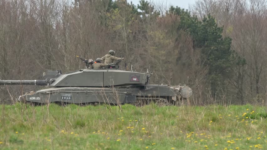 British army FV4034 Challenger 2 II main battle tank and Warrior FV510 IFV in action on a military exercise