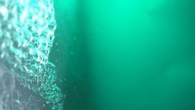 vertical video. soap bubbles on a monochrome gray background in contrasting blue color fall and fly. a waterfall of large and small soap bubbles - Powered by Shutterstock - Get 15% off with code: PIKWIZARD15