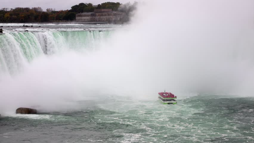 Niagara Falls with tour boat near Horseshoe Falls on a cloudy day in Ontario, Canada
