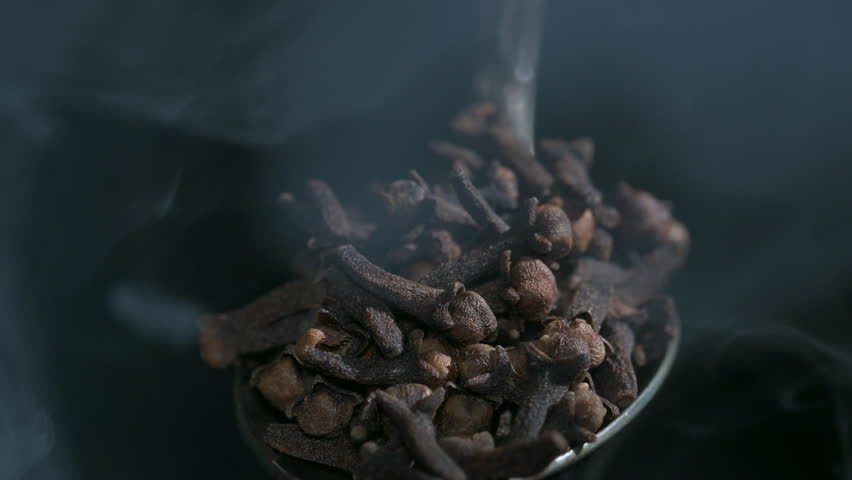 Smoke Effect On Top Of Clove Grains In Metal Spoon