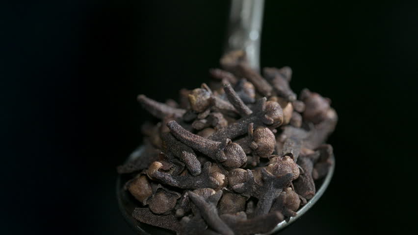 Smoke Effect On Top Of Clove Grains In Metal Spoon