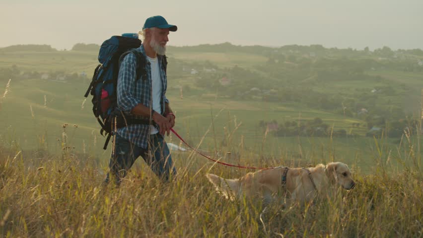 Cardiovascular Health, Mental Wellness, Active Aging. Senior Man Hikes in the Mountains, Enjoying Retirement and Nature. Inspiring Scene of Freedom, Strength, and Positive Aging