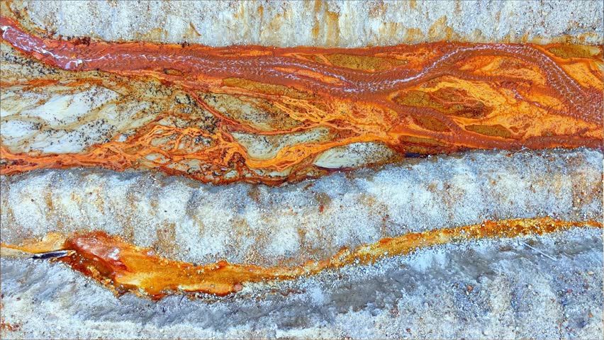 Drone abstract footage of the nature pollution and water contamination of the copper mine exploitation in Geamana, near Rosia Montana, Romania, Europe	