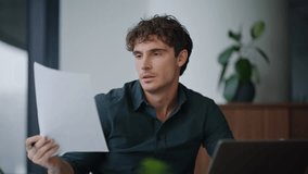 Disappointed worker reading report worried company financial result in office closeup. Frustrated businessman reviewing document looking laptop at workplace. Overloaded man looking problem solution. - Powered by Shutterstock - Get 15% off with code: PIKWIZARD15