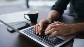 Serious financier working in office financial company closeup. Professional businessman thinking on project typing laptop sitting workplace. Enthusiastic manager writing business plan in copybook. - Powered by Shutterstock - Get 15% off with code: PIKWIZARD15