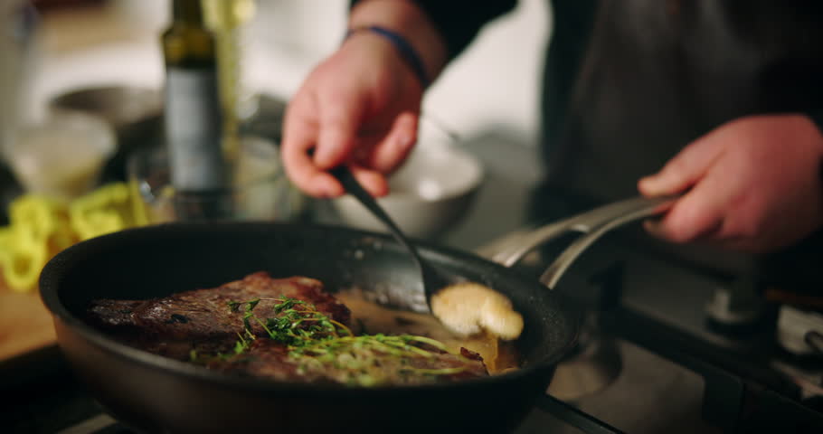 Recipe, hands and meat in frying pan in kitchen for cooking dinner, meal preparation and sear beef cuisine. Chef, person and steak with herbs for healthy ingredients, nutrition and lunch food in home