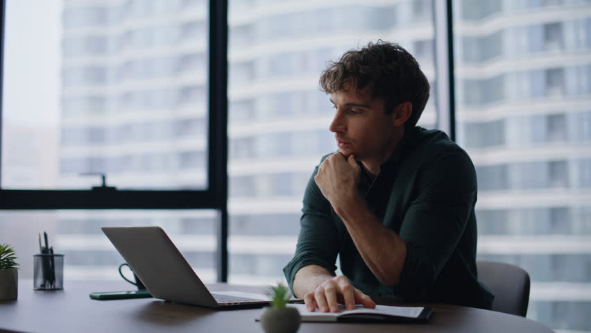 Stressed loser reading laptop bad news at contemporary workspace closeup. Shocked businessman failing project closing computer emotionally. Frustrated director losing money feeling despair in office.