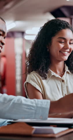 Students, friends and discussion in university library for research, education and knowledge in team project. Studying, people and learning on campus with books, support and help with scholarship