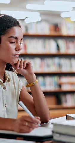 Headphones, library and woman student writing notes for research, knowledge or practice test. Education, college and female person study for exam with books, music or lecture podcast for assignment