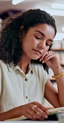 Woman, student and reading book in library for education, knowledge and information on project. Person, textbooks and study for exam preparation, university assessment and learning of academic growth