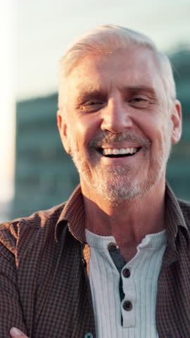 Laughing, crossed arms and face of mature man in city with confidence for creative job. Happy, pride and portrait of male copywriter with positive attitude for journalism career in urban town.