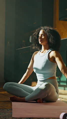 Prayer, meditation and woman in yoga pose in home for relax, zen or mental health in living room. Calm, inner peace and female person with mindfulness, aura or spiritual growth in morning in house.