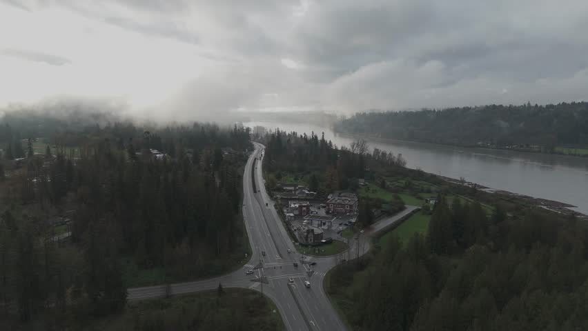 Foggy Highway Intersection and River in British Columbia, Canada