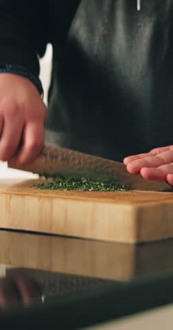 Cooking, hands and knife with person in kitchen of home for cuisine or meal preparation. Cutting, ingredients and recipe with chef at counter in apartment for diet, health or nutrition closeup