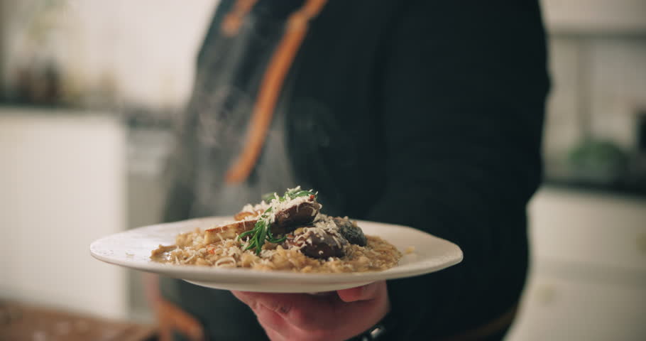 Hands, person and plate with food in kitchen for fine dining, nutrition cuisine and catering service. Chef, cooking and presentation with meal preparation, serving lunch and diner aesthetic at house