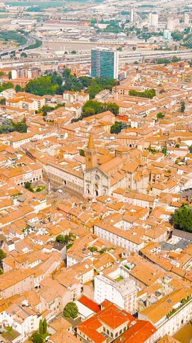 Vertical video. Piacenza, Italy. Cathedral of Piacenza. Episcopal Palace. Historical city center. Summer day, Aerial View. Rich colors