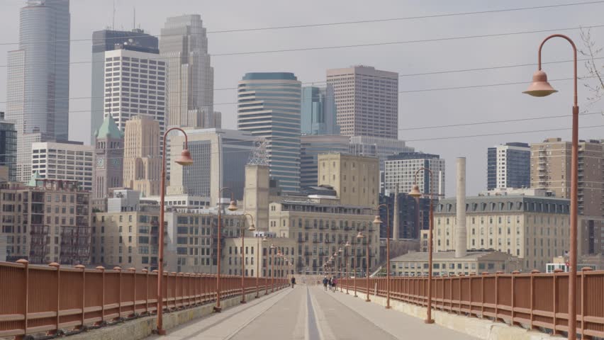 Downtown Minneapolis From Stone Arch Bridge In Minneapolis, Minnesota. - wide shot