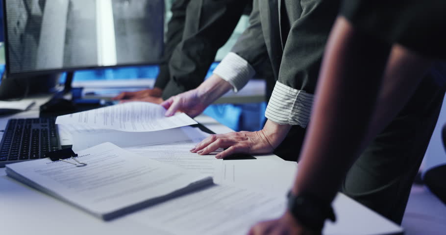 Hands, people and paperwork with planning, business and teamwork with compliance. Group, employees and cooperation in workplace, documents or surveillance with feedback for safety policy or talking