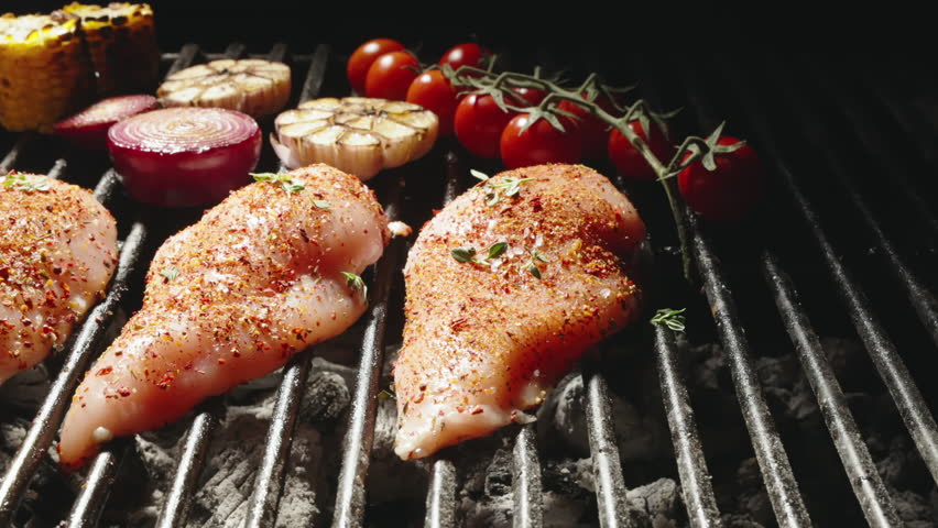 Smooth movement. Bright flavors of grilled vegetables cherry tomatoes garlic onions corn and hot peppers add piquancy to main dish juicy chicken steak seasoned with spices. Tantalizing aroma fills air