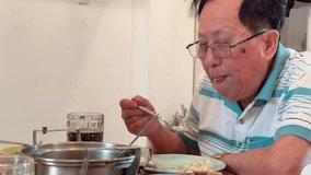 The East Asian senior couple is eating lunch together in the dining room. - Powered by Shutterstock - Get 15% off with code: PIKWIZARD15