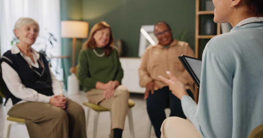 Elderly women, caregiver and tablet for support group in home with advice, therapy and wellness. Senior people, therapist and tech with health education, help and counseling for arthritis or grief