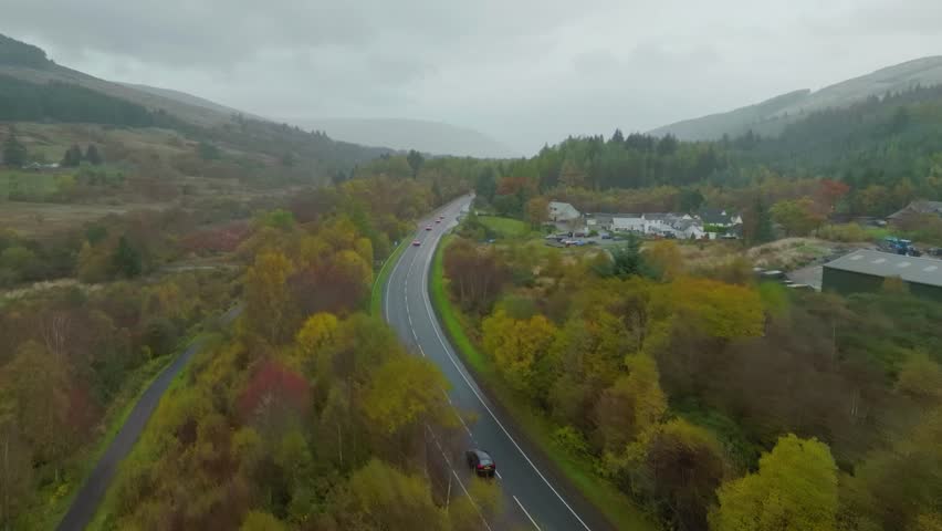 Remote Scottish Highland road and accommodation in countryside, aerial