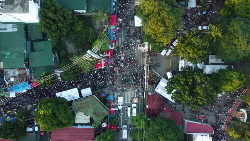 Top down drone shot above the crowded gate to the south cemetery, in Manila