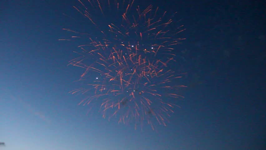 Fireworks erupt to color darkening night sky at 4th of July celebration
