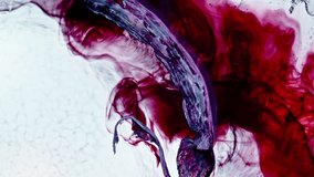 Red ink swirling underwater in extreme close-up, abstract and moody macro scene - Powered by Shutterstock - Get 15% off with code: PIKWIZARD15