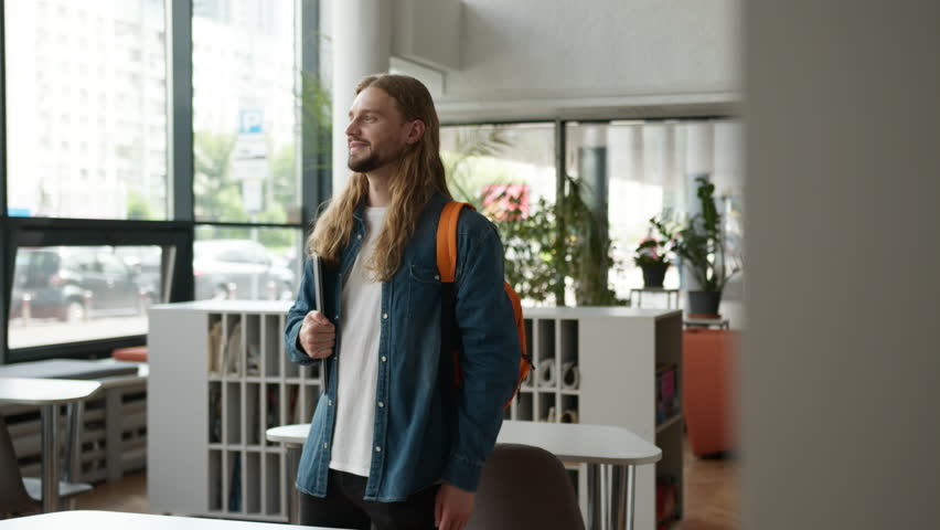 Male indoors office college academy university laugh having fun rejoice funny reaction Caucasian man guy businessman student business smiling laughing joy joyful humorous good mood studying education