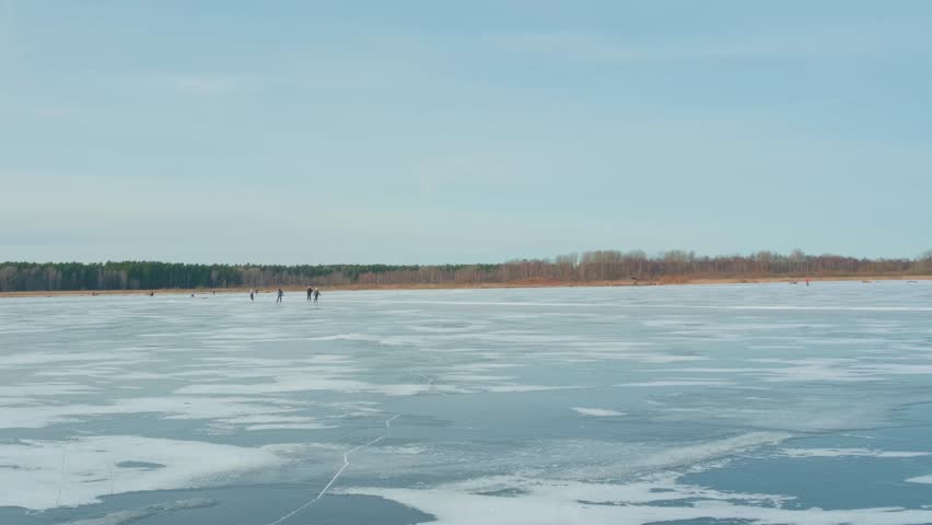 Ice skating on a clear winter lake