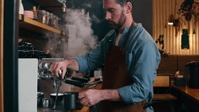 Adult Caucasian small business owner worker waiter barista male prepare order cafeteria catering guy man bartender pour hot espresso stream in mug coffee machine equipment in cafe employee make drink - Powered by Shutterstock - Get 15% off with code: PIKWIZARD15