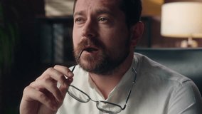 Pensive puzzled Caucasian employee taking off glasses man male entrepreneur pondering in office leader worker job problem business question businessman contemplating corporate boss think about answer - Powered by Shutterstock - Get 15% off with code: PIKWIZARD15