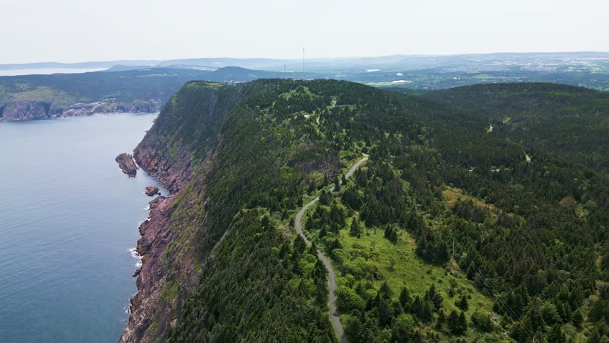Drone shot of Red Cliff Newfoundland showing Logy bay in the distance and St. John