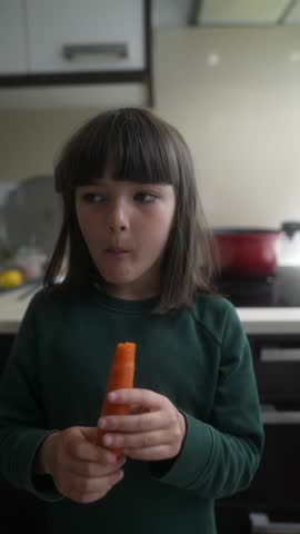 A Happy Child Enjoying a Bright and Colorful Carrot Snack in Their Cheerful Kitchen at Home