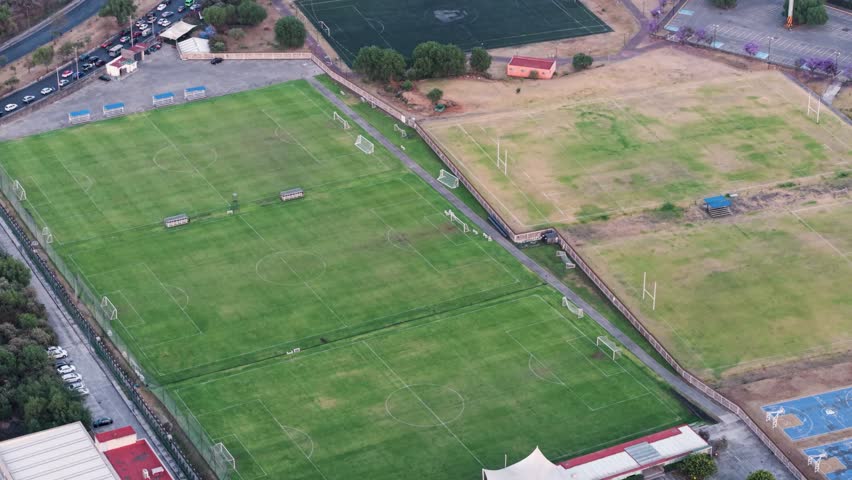 Aerial drone shot of football pitches and sports facility