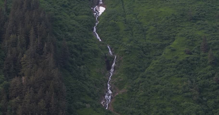 Waterfalls on Mount Juneau in a sunny summer day, Alaska.