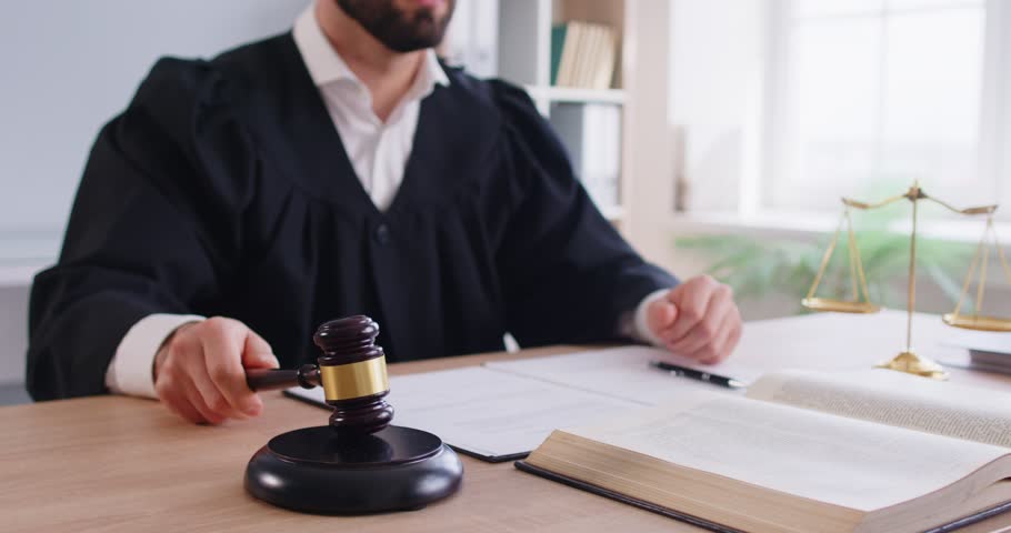 Male judge law authority using gavel, wooden hammer bangs to sentence in court of law, accuse guilty, proclamation, passes judgement, hitting table to get attention, punctuate rulings, final decision 