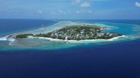 Aerial view of local village at tropical island.Drone point of view at Thulusdhoo island. Kaafu atoll.Maldives.Wide angle slow motion video - Powered by Shutterstock - Get 15% off with code: PIKWIZARD15