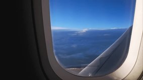 Airplane Window View Above the Clouds at Sunset - Powered by Shutterstock - Get 15% off with code: PIKWIZARD15