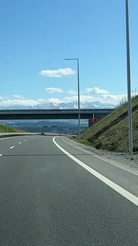 picturesque mountain road, mountain peaks in snow, clouds. clouds. Travel in Poland, High Tatras