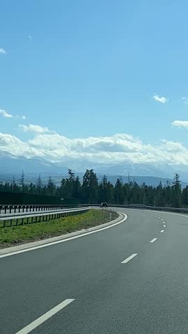 picturesque mountain road, mountain peaks in snow, clouds. clouds. Travel in Poland, High Tatras