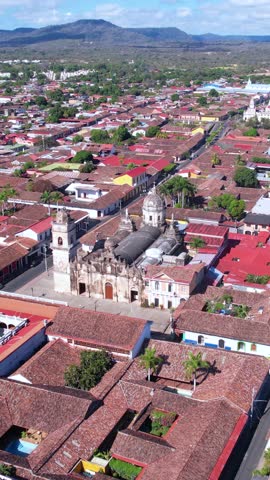 Granada, Nicaragua. Vertical Drone Shot of Nuestra Senora de la Merced Catholic Church, Streets and Homes
