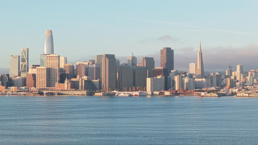 Slow aerial drone zoom in of downtown San Francisco, California showing the iconic Embarcadero. Shot in 4K.