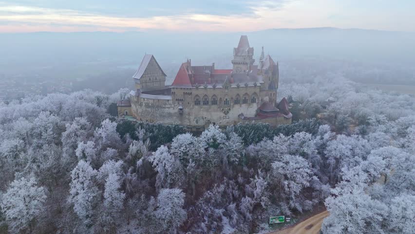 Aerial View Of Kreuzenstein Castle Surrounded By Snowy Trees In Leobendorf in Lower Austria, Austria. - orbit shot