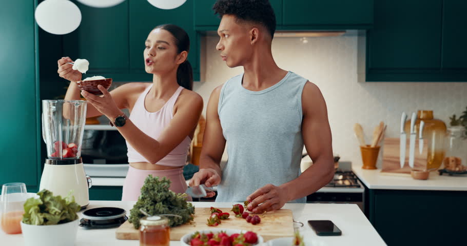 Smoothie, help and blender with couple in kitchen for nutrition, bonding and fitness diet. Detox, health and recipe with man and woman with fruit at home for drink, weight loss and breakfast